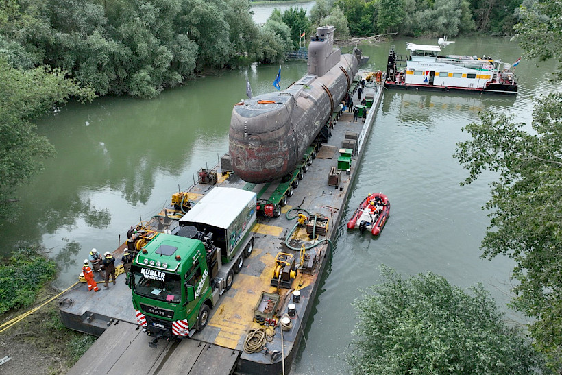 Roll-on of the submarine on the river pontoon